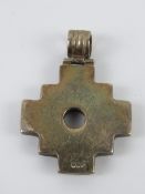 An unusual white metal pendant having cross form with articulated bale, 3.7cm in length.