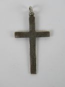 A silver crucifix pendant having scrolling engraving to front, stamped sterling, 3.