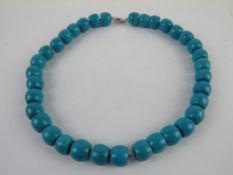 A heavy turquoise beaded necklace with silver clasp, total weight 107.9g.