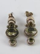 A pair of articulated silver earrings, set with citrine coloured stones, stamped 925.