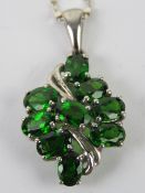 A silver and green gemstone cluster pendant, 3.1cm inc bale, stamped 925, on silver chain.
