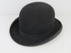 A felted bowler hat by Challenge aperture 7.5 x 6 1/4 approx 6 3/4. Slight a/f.