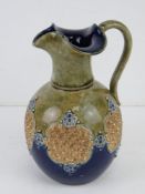 A Lambeth type Royal Doulton 8294 pattern art pottery jug,