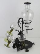 A Vintage Austrian / Bavarian black metal and etched glass wine warmer with four mid century footed