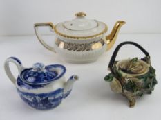 An early 20thC teapot in the form of a shell together with a blue and white Wedgwood bachelor's