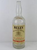A 4.5 litre Bells Scotch Whiskey bottle, contents deficient, for display purposes.