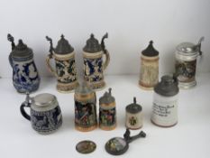 A quantity of 20thC ceramic beer steins having assorted themes, one with lithophane to base,