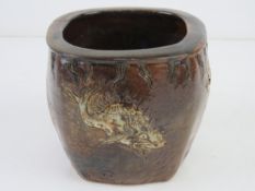 A Martin Brothers stoneware pot decorated with fish in brown ground, 9.5cm high.