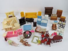 A quantity of vintage mid century wooden and other dolls house furniture including Dol-Toi items.
