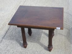 An unusual oak occasional table raised over four substantial turned and reeded legs, 64 x 46 x 50cm.