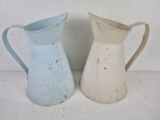 A matched pair of contemporary jugs for floral arranging being cream and pale blue,