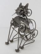A wine bottle holder in the form of a cat.