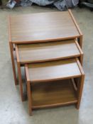 A nest of three mid 20thC tables bearing label for Ashcraft, largest 50 x 37.5 x 42cm.