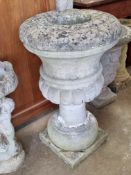 A large pre-cast stone planter, a/f, 77cm high.