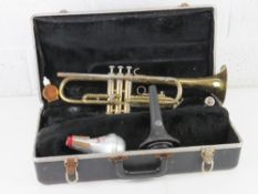 A vintage trumpet having silvered mouthpiece, a/f, in case marked The Selmer Company.