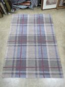 A 'Highland' pattern rug from Dunelm, 120 x 170cm.