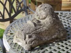 A pre-cast hedgehog garden ornament, 31cm in length.