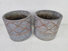 A pair of grey and copper coloured planters 16cm dia.