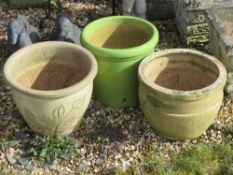 Three contemporary garden pots, 23 - 26cm high.