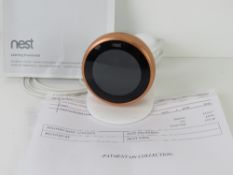A Nest thermostat, turns on, untested, with instructions.