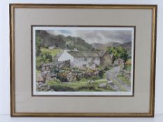 A signed limited edition print of a stone farmhouse with mountains beyond,
