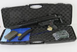 A deactivated HK MP5SDA3 9mm Suppressed