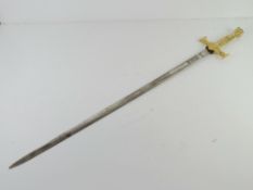 A Masonic sword with a patterned blade.