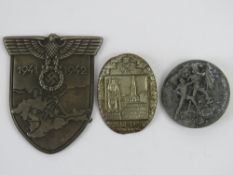 A WWII German Krim shield and two day ba