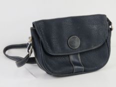 A vintage blue leather Shilton Internati