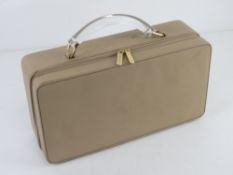 An Estee Lauder makeup case having lucit