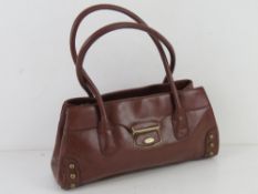 A brown leather handbag by Fiorelli appr