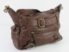 A brown leather handbag by River Island
