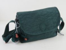 A green canvas cross body bag by Kipling