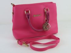 A contemporary hot pink handbag, 30cm wi