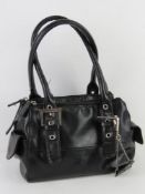 A small black handbag by Debenhams havin