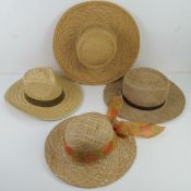 Four straw hats, various styles, one bea