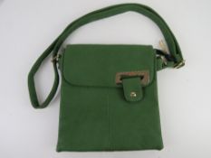 A green cross body handbag approx 25cm w
