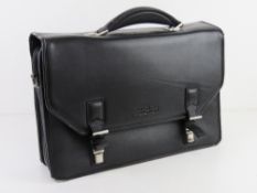 A Kenneth Cole brief case some wear note