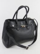 A black leather handbag by Oasis, mark t