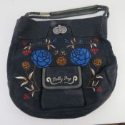 An embroidered floral fabric tote bag by