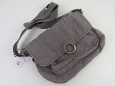 A grey handbag by Kipling, key chain def