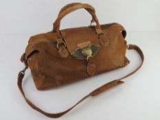 A cow hide handbag by Louise Hempleman h