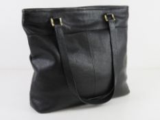 A black leather tote bag by Dickins & Jo