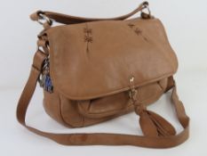 A tan leather handbag by Radley approx 3