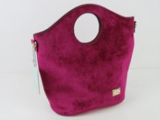 A fushia velvet handbag by Bessie London