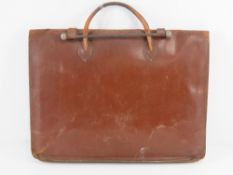 A vintage leather ladies briefcase havin