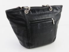 A black leather handbag made in France b