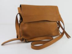 A mustard coloured cross body bag by M&S