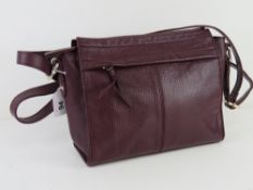 A plum coloured leather handbag by M&S,