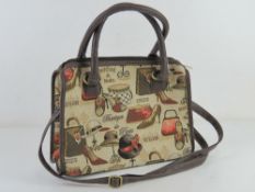 A tapestry type fabric handbag approx 32